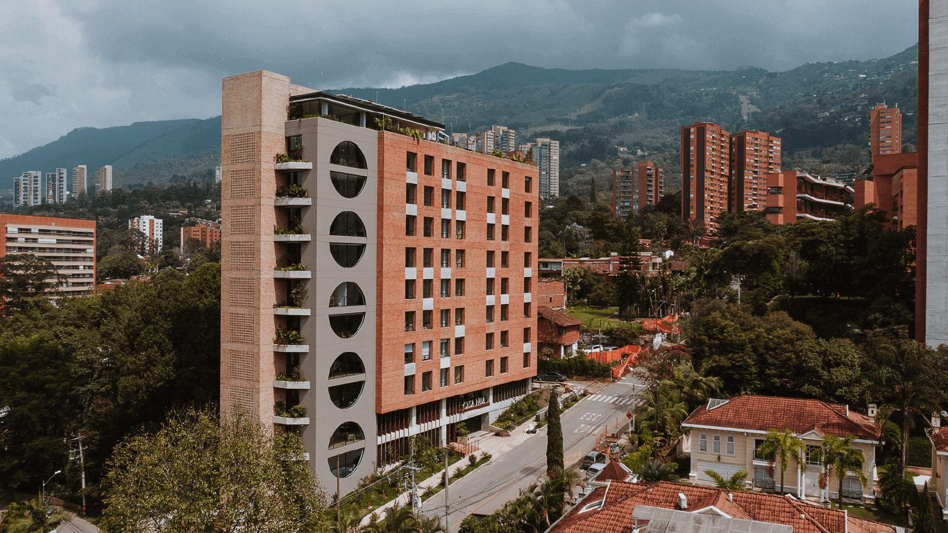 A building with many windows and some trees